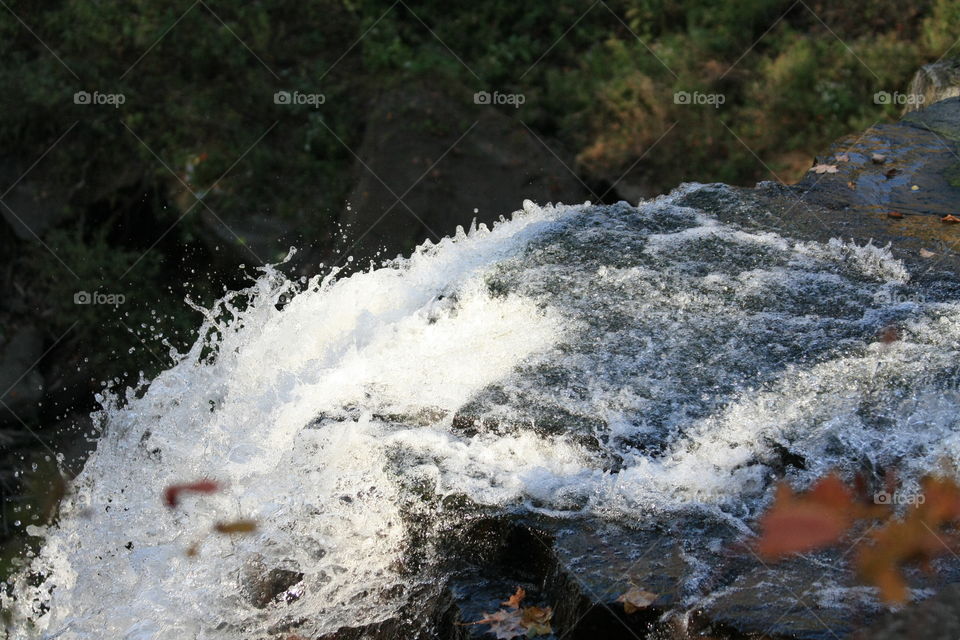 first signs of autumn by the waterfall in Cleveland, Ohio, USA