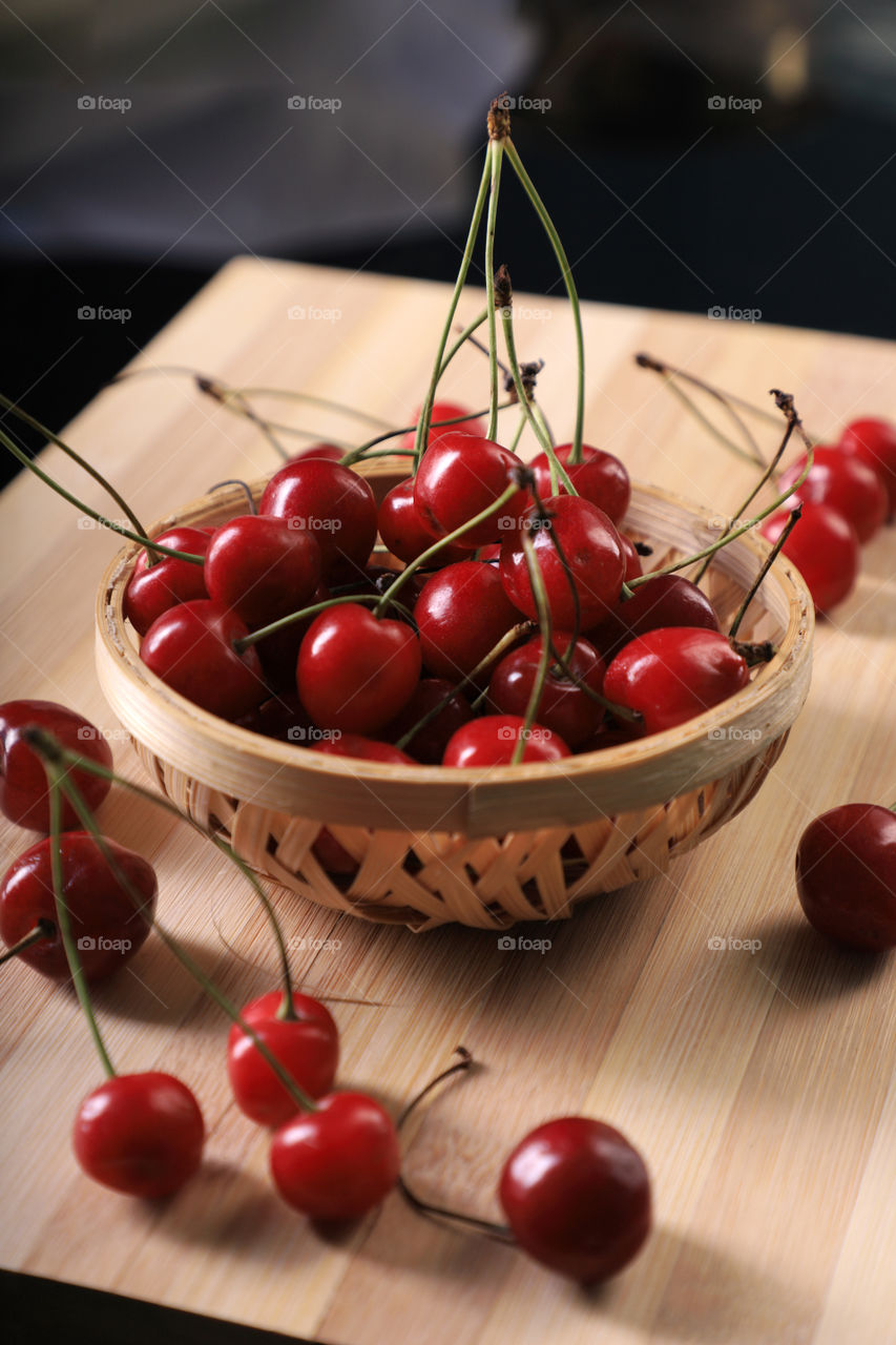 Fresh Red Cherries in a small basket