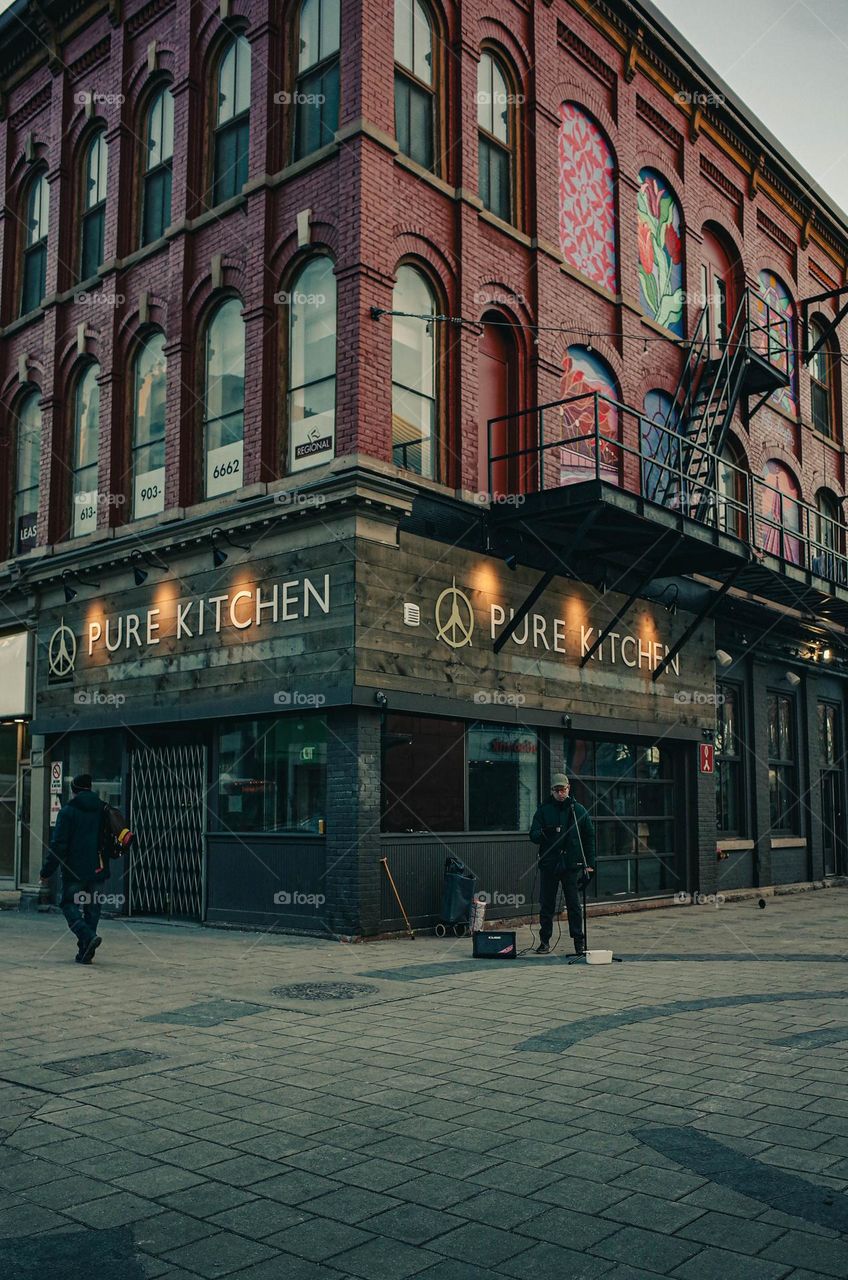 People walking around in an urban downtown city.