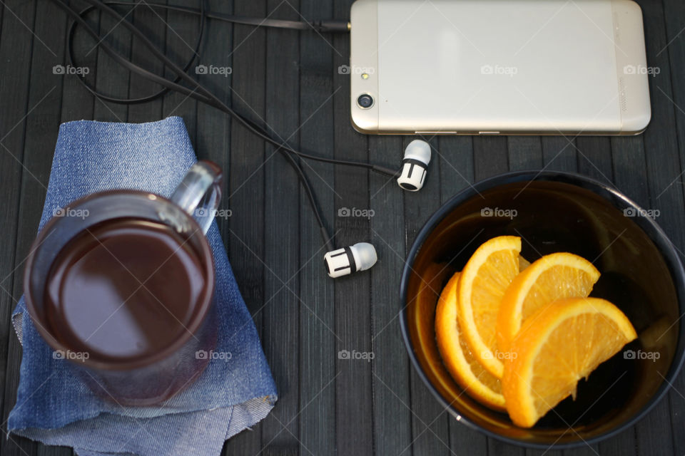 Tea tradition, tea, cup, mug, hot drink, cinnamon, cookies, napkin, jeans, denim napkin, fruit tea, flower tea, citrus, orange, lemon, rose petals, cookies, chocolate cookies, vanilla, vanilla sticks