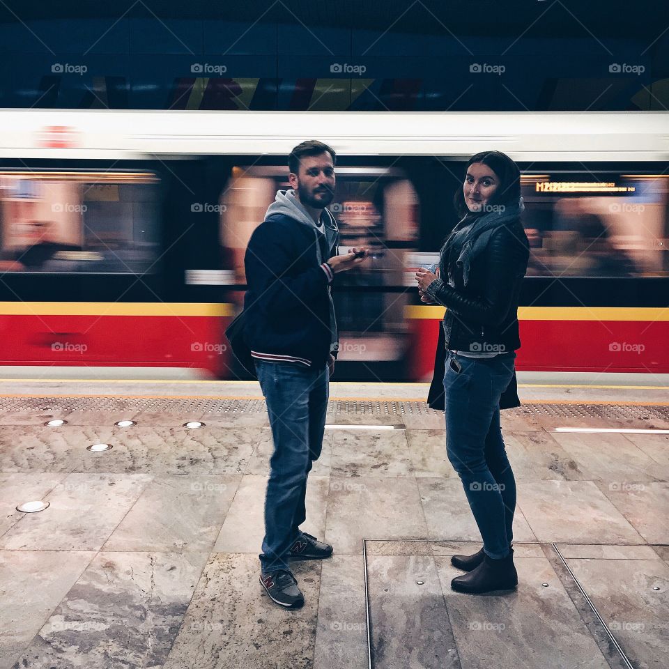 Beautiful couple standing on platform