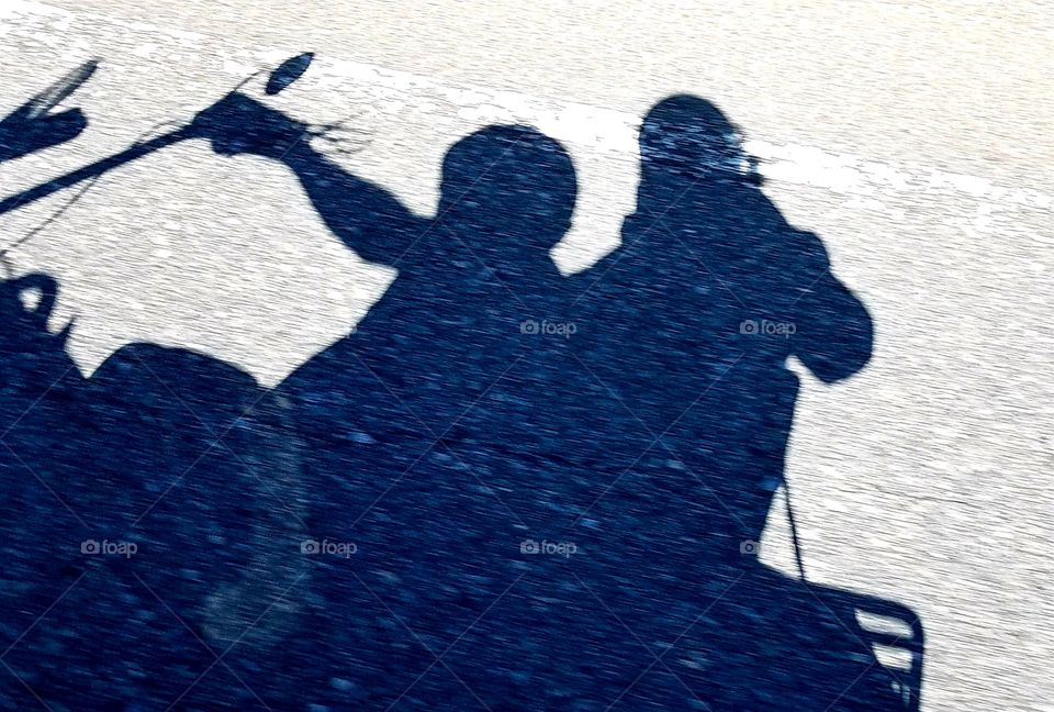 Shadow of two riders on motorcycle, sunny bright day. Shadow people.