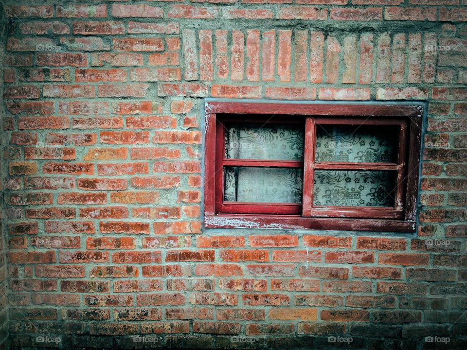 Old brick wall and window in Taiwanese village.
