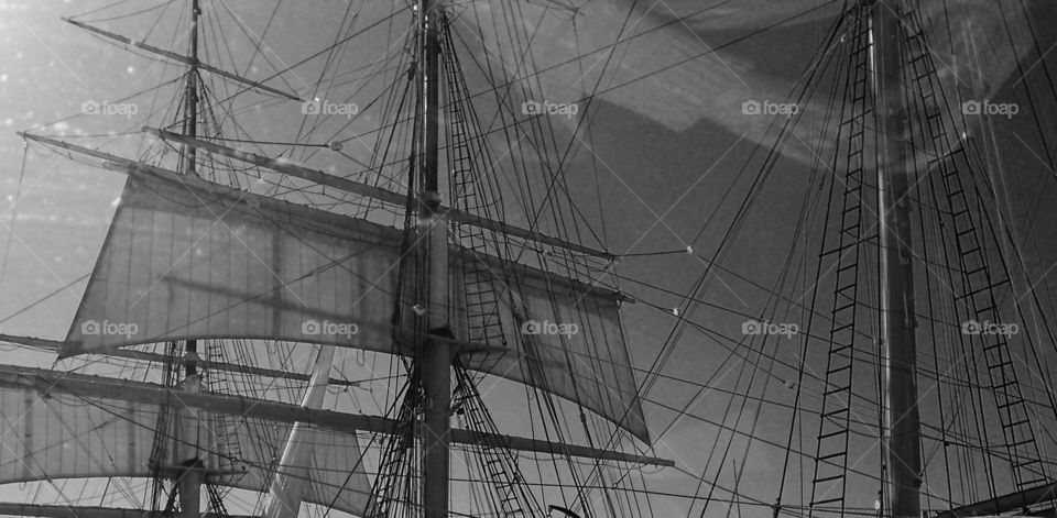 Ghost hands working on the rig. Riggings of the sailing ship of the Maritime Museum in San Diego. As I shot this from the car, my Moms hands reflected.