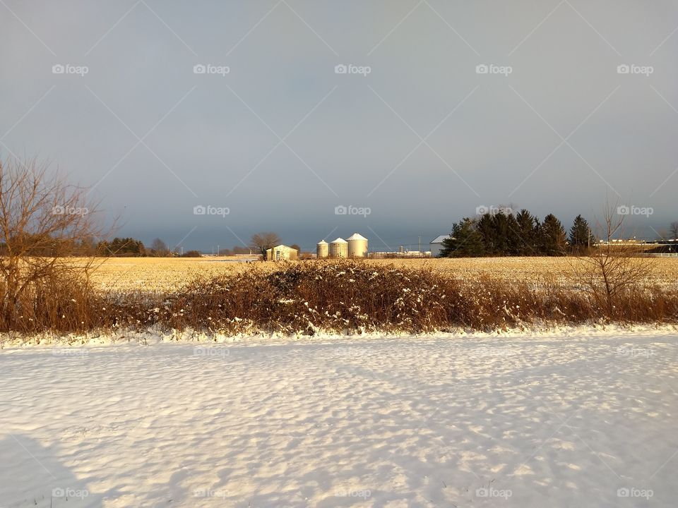 Midwest winter landscape with barn.