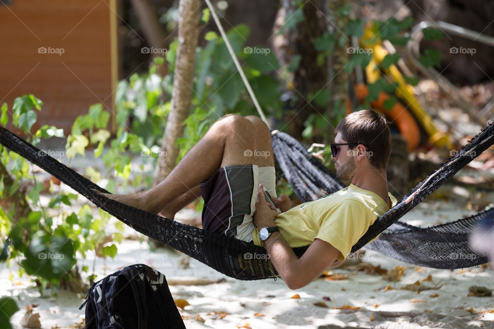 Tourist playing a smartphone 