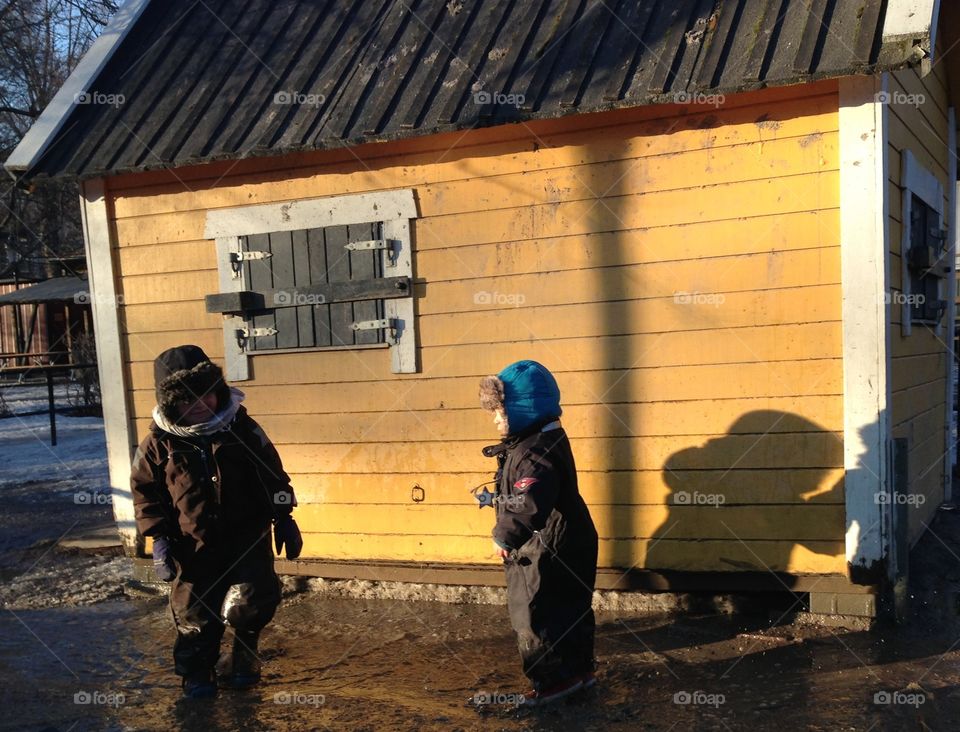 Kids playing in puddle