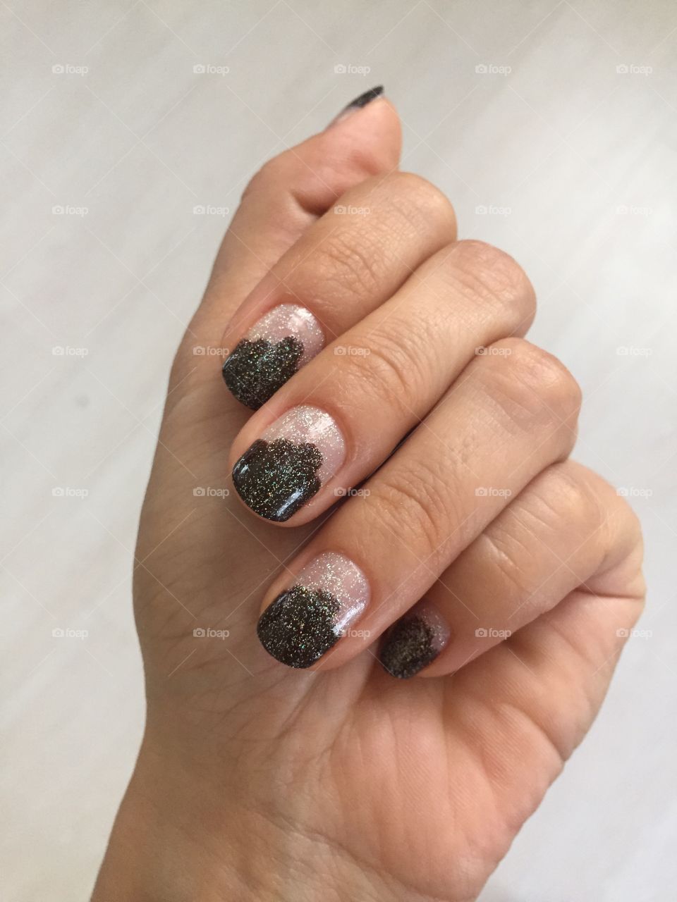 Manicure with dark brown stripes trimmed with silver tinsel