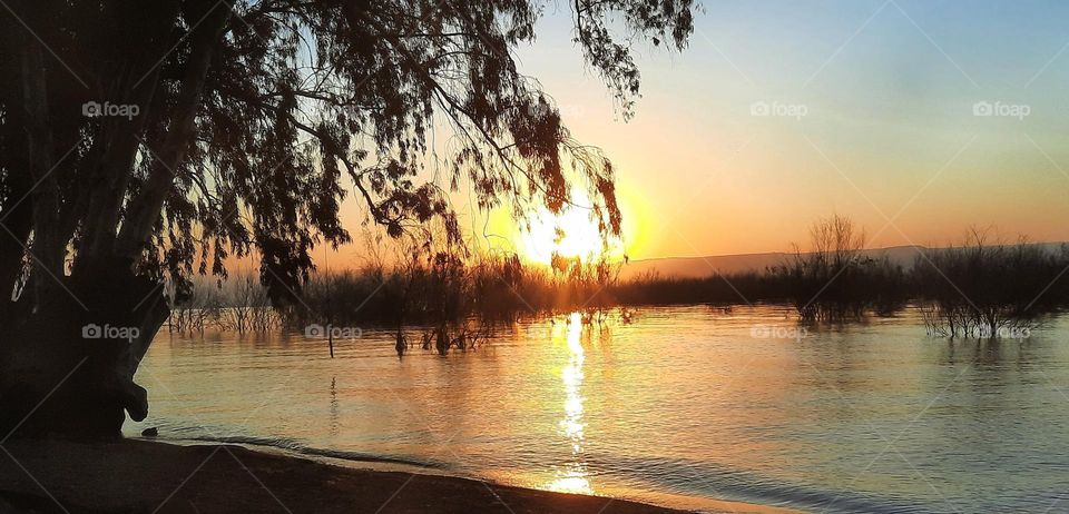 sunrise on the beach of the sea of Galilee in israel