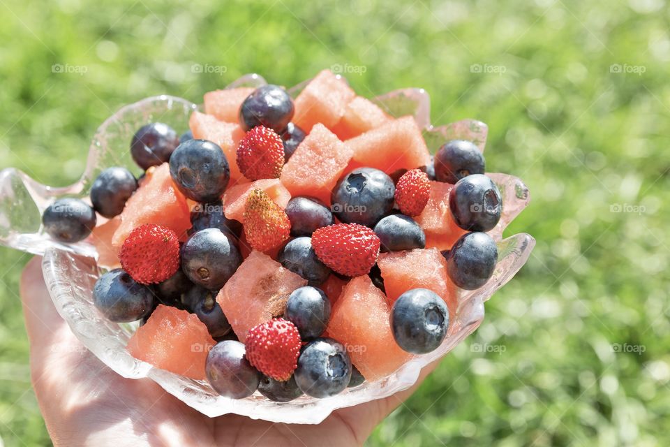 Having fresh berries and fruit 
