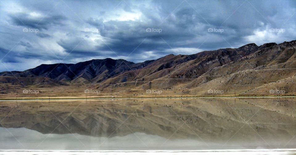 Reflection hills. Hills reflected in lake water