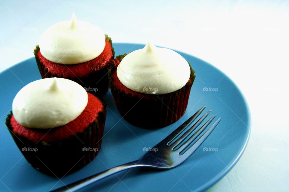 red velvet cupcake on a plate with fork