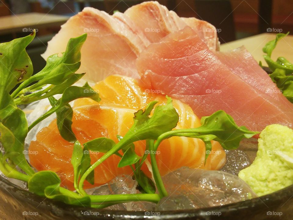 sashimi. a dish of sashimi (raw fish) of salmon, muguro, and hamachi