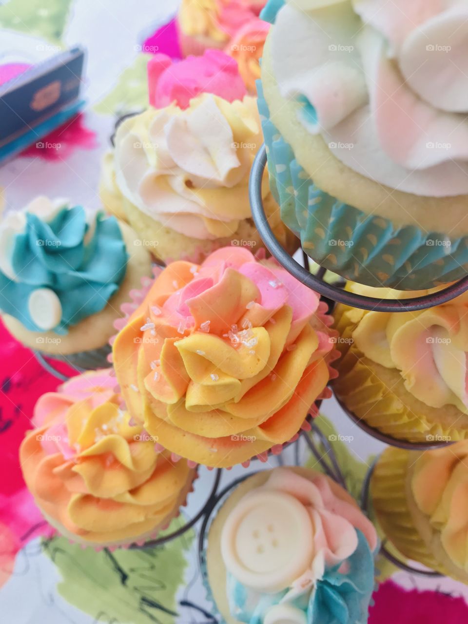 Gorgeous delicious yummy cupcakes beautifully decorated with multi colored frosting and chocolate molds! 