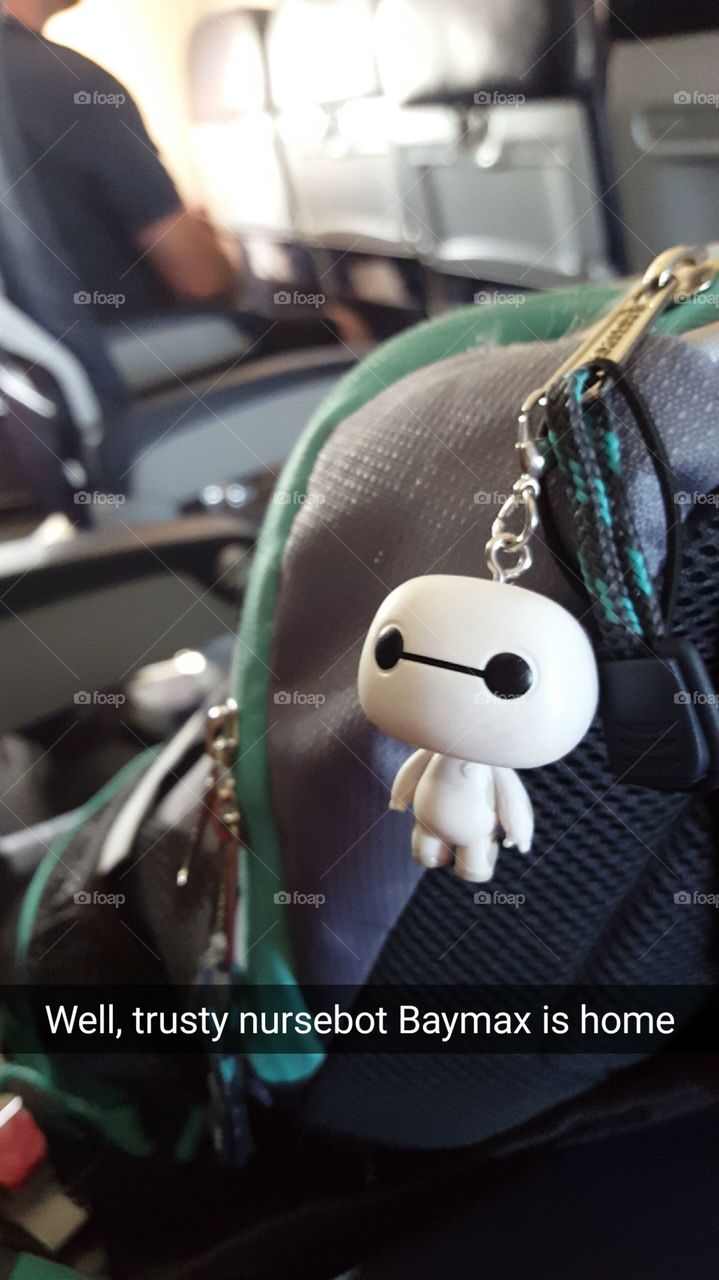 Baymax guarding my backpack on the plane