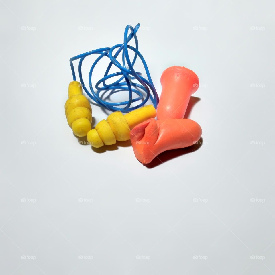 Colored ear plugs on table