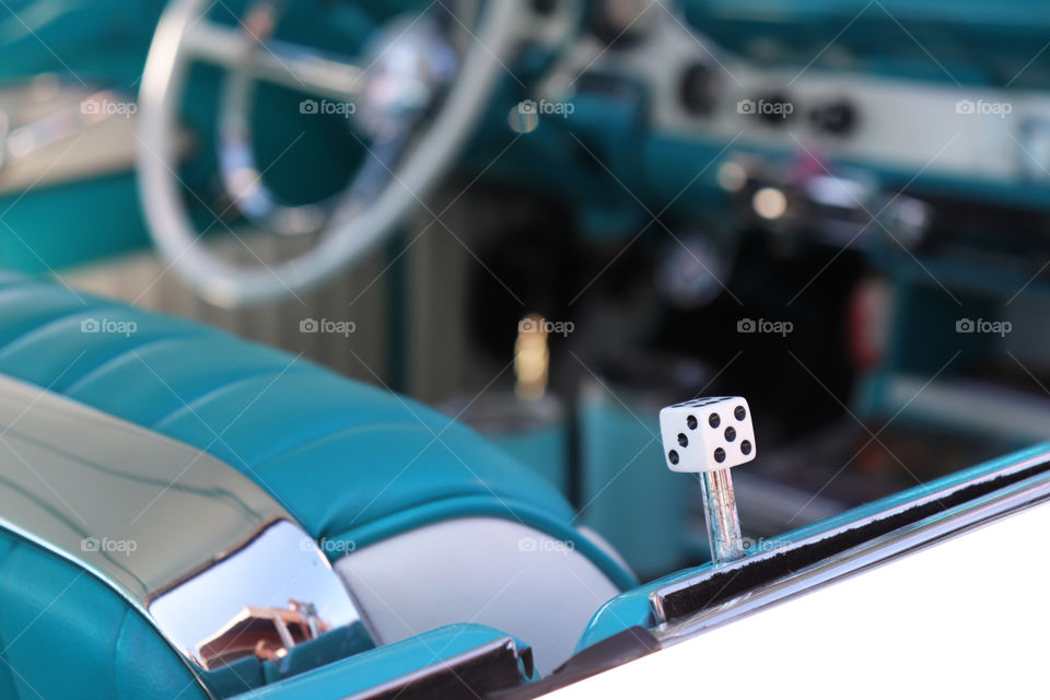 Inside of a vintage car, focus on the lock button