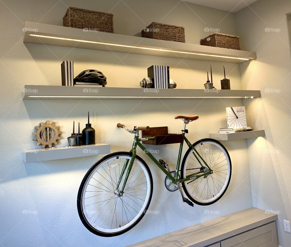 Bicycle displayed on the office room wall - interior design 