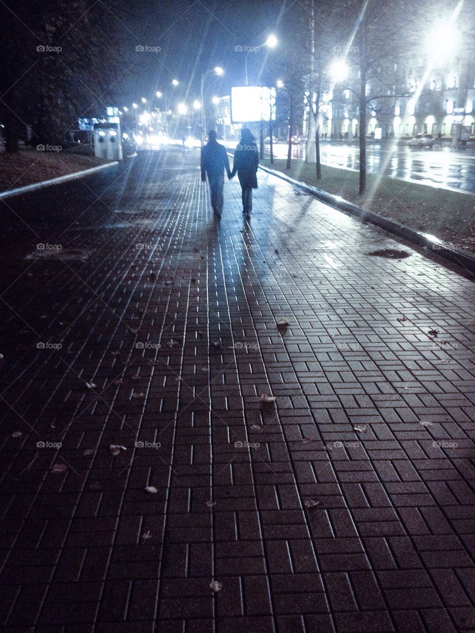 Couple walking at night city