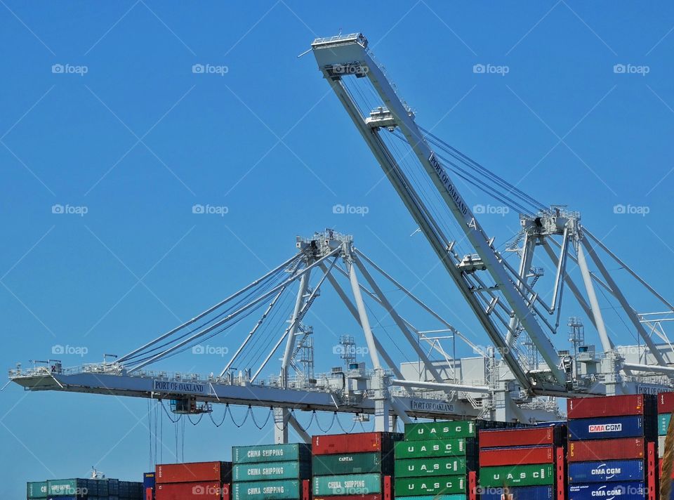 Industrial Cranes. Cranes Loading A Cargo Ship In Port
