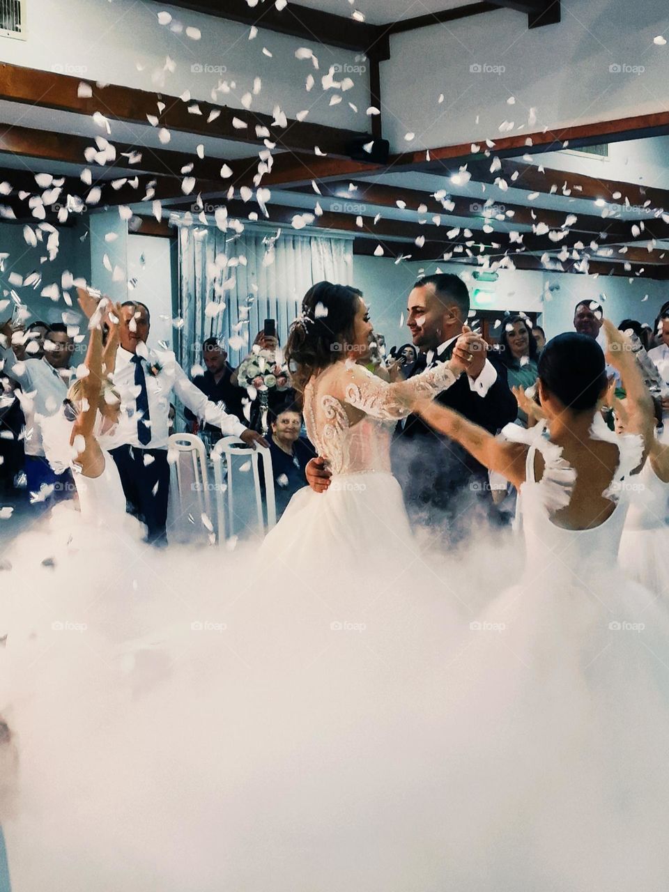 the dance of the bride and groom in the white smoke