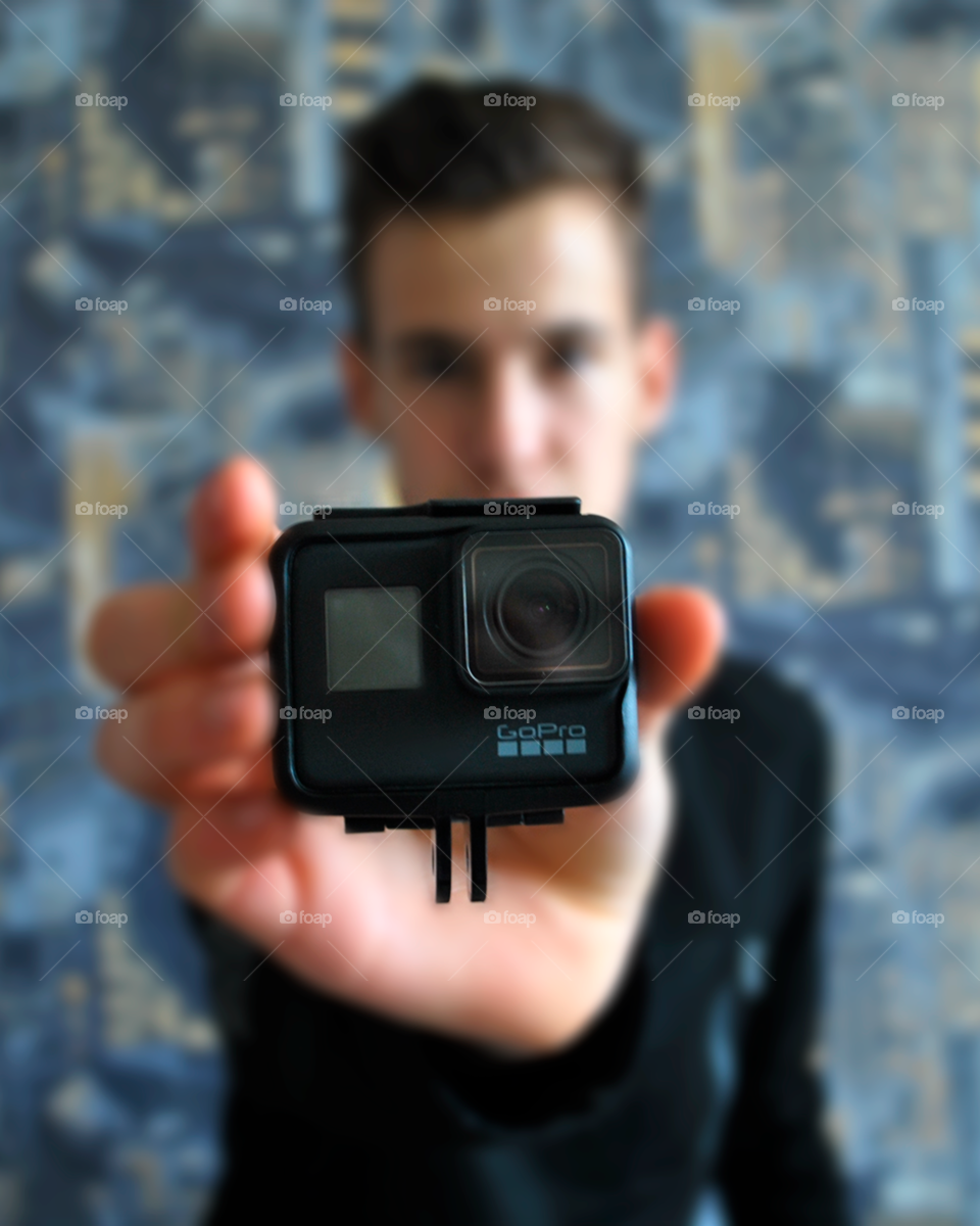 Guy holding GoPro 7 Black 