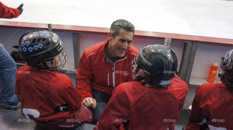 Hockey Coach talking to his team