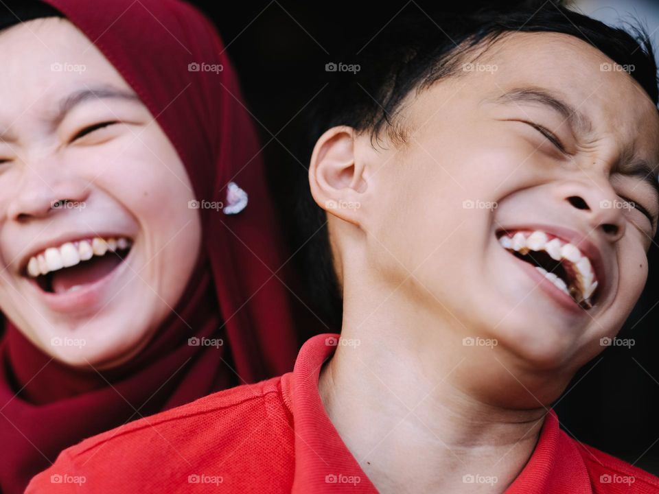 Siblings in laughter