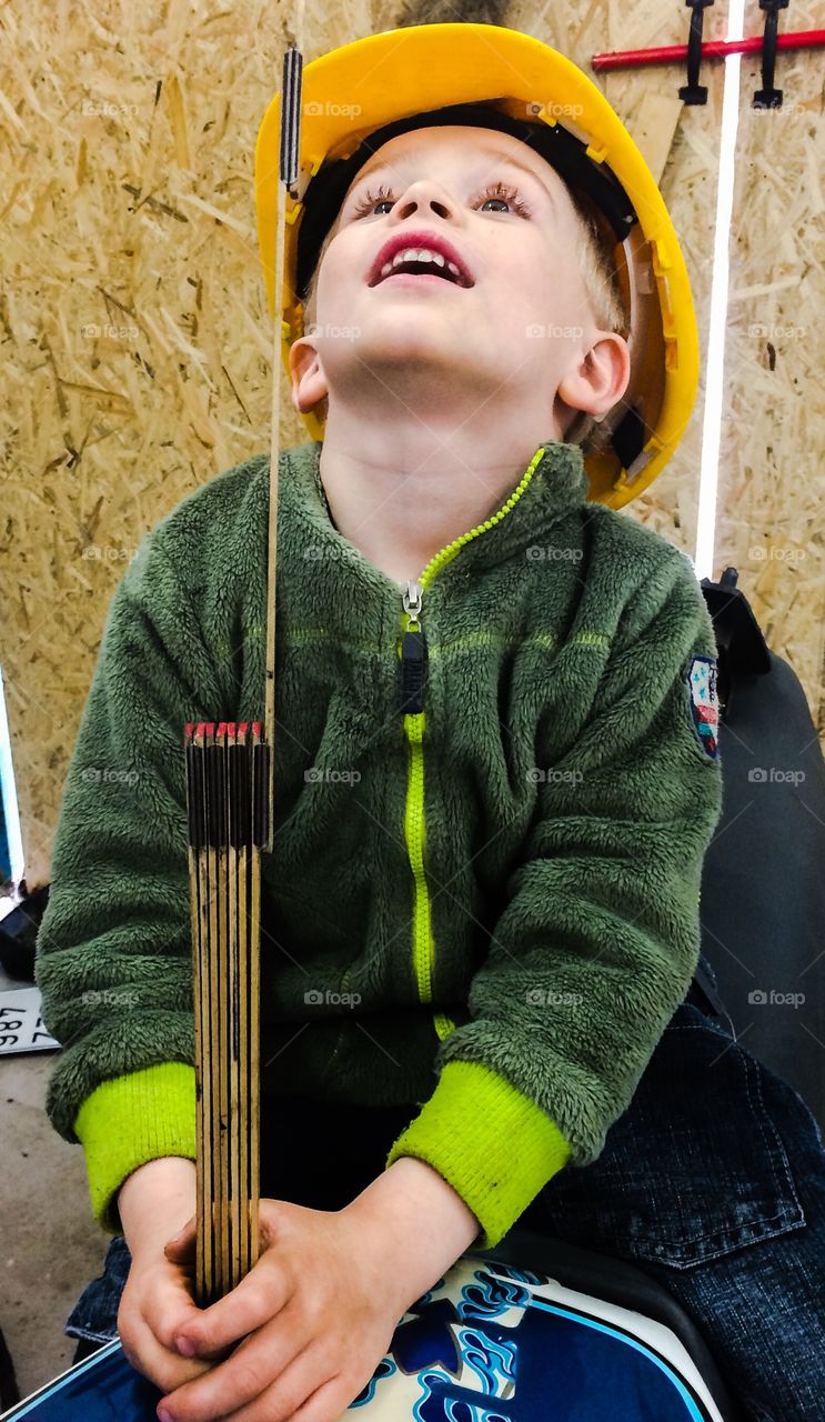 Boy with a folding ruler. It's very interesting with a folding rule. How long is it?