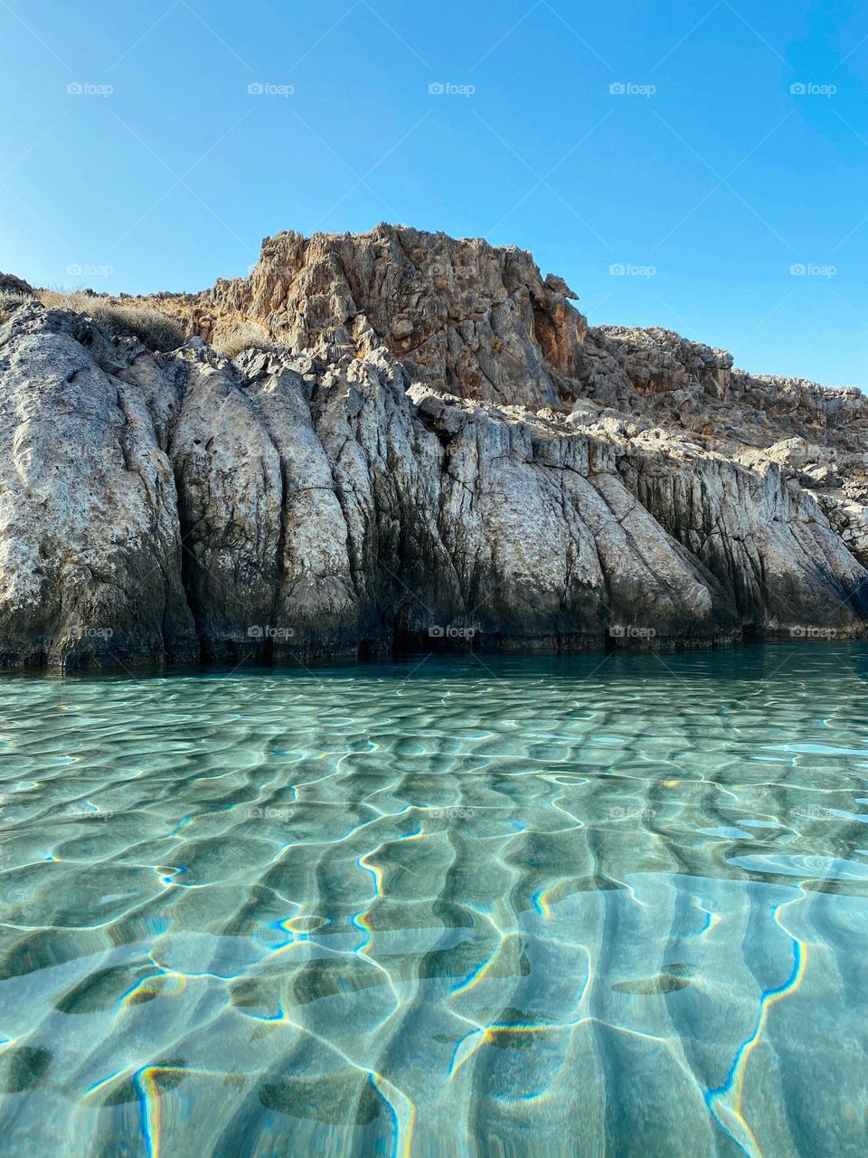 Crystal clear water of Cretan beach 