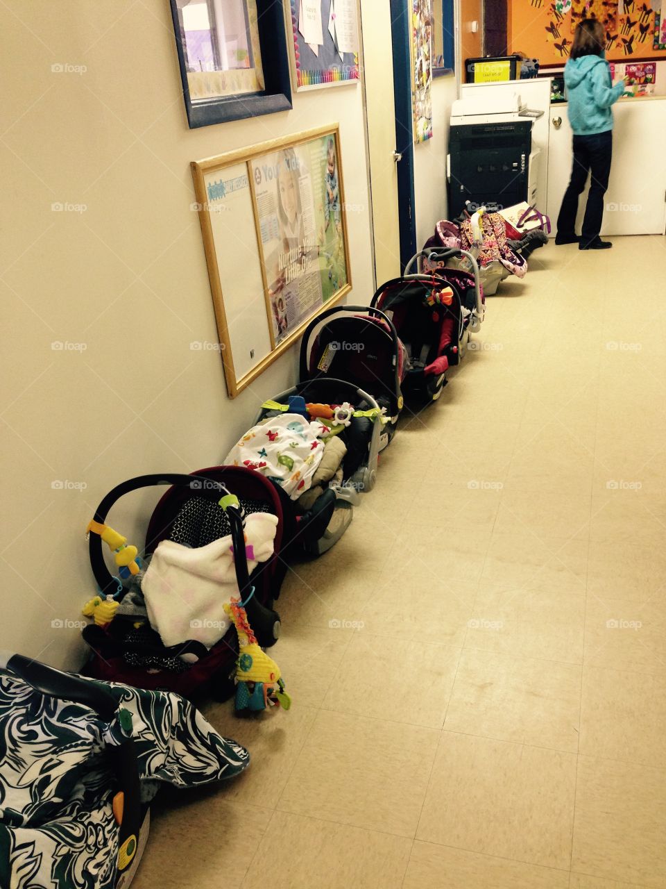 Track Infant Carriers. This daycare scene disturbed me, so I took a picture. This might be part of what is wrong with this world. 