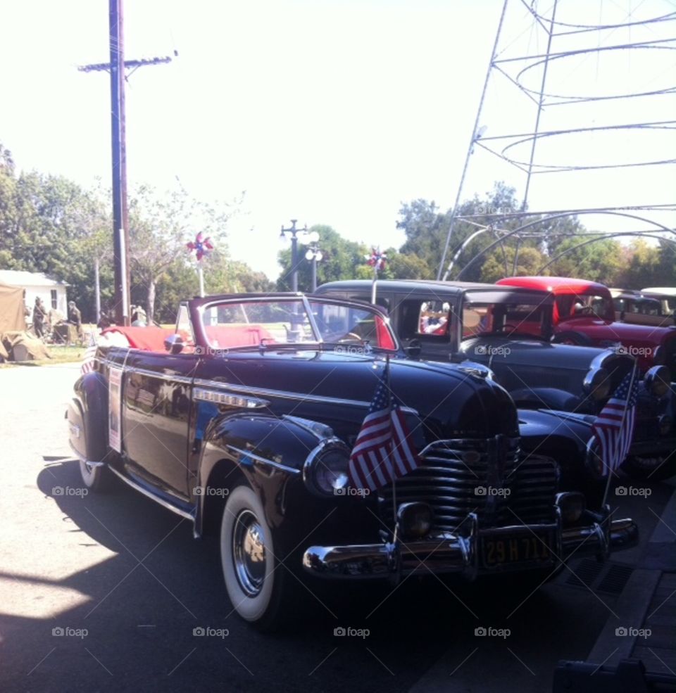 History reenactment.  remembering the 19 40's  with cars, parades, soldiers, music and dancing