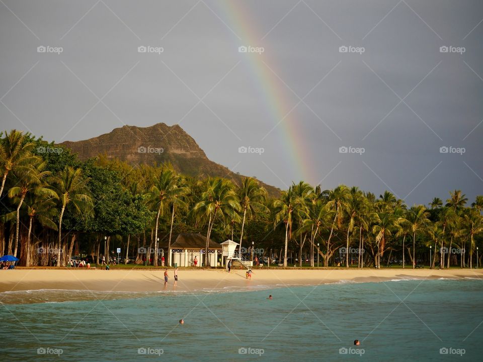 Waikiki beach Hawaii rainbow over diamond head crater