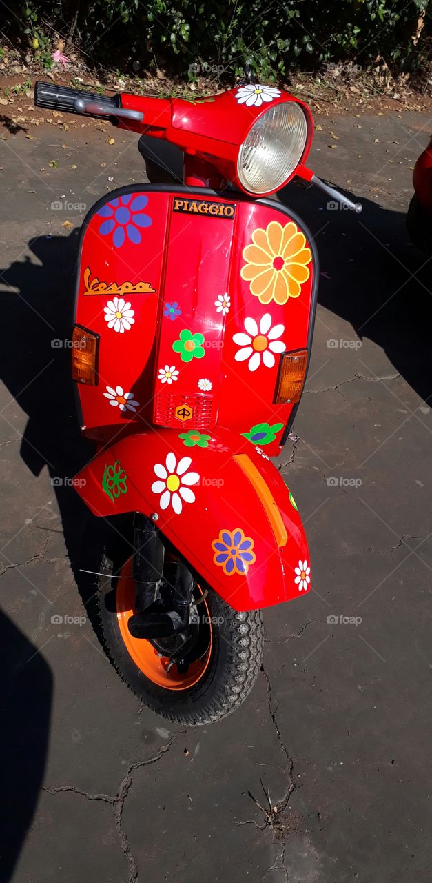 red scooter with flowers