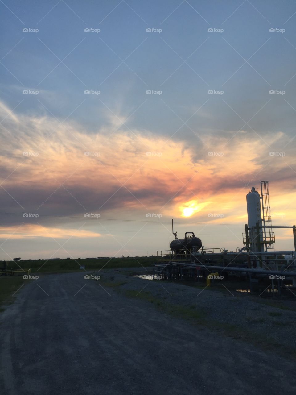 Oilfield land facility sunset 