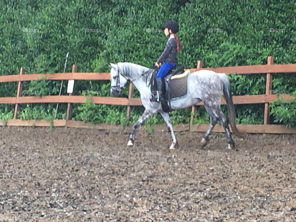 Girl has riding lesson