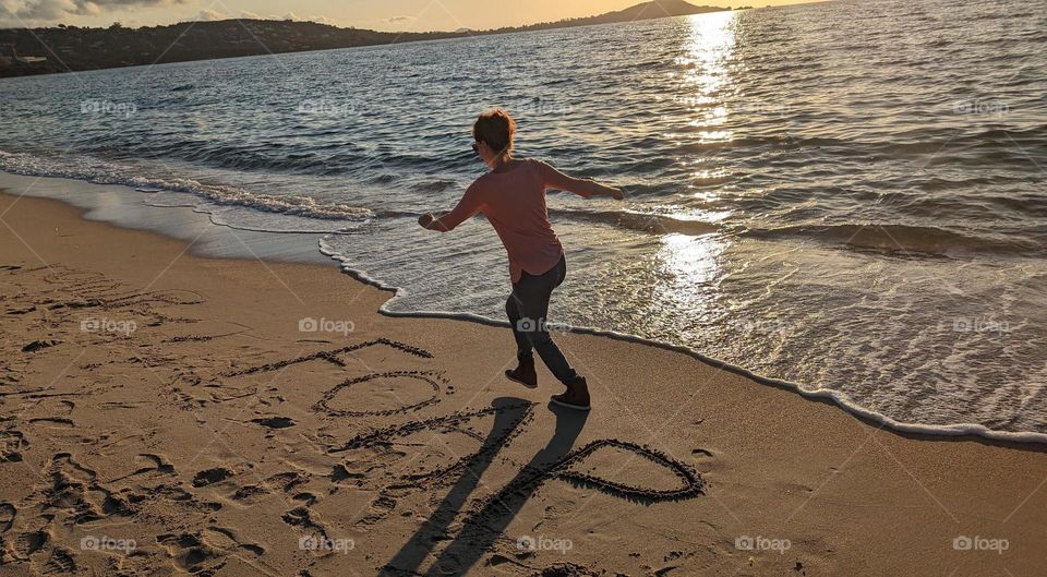 woman running on the beach