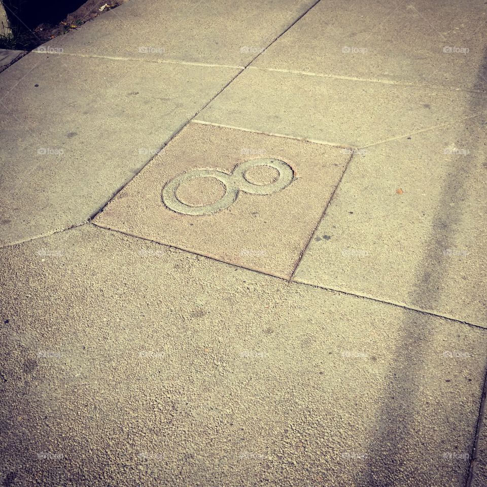 The number eight on the sidewalk