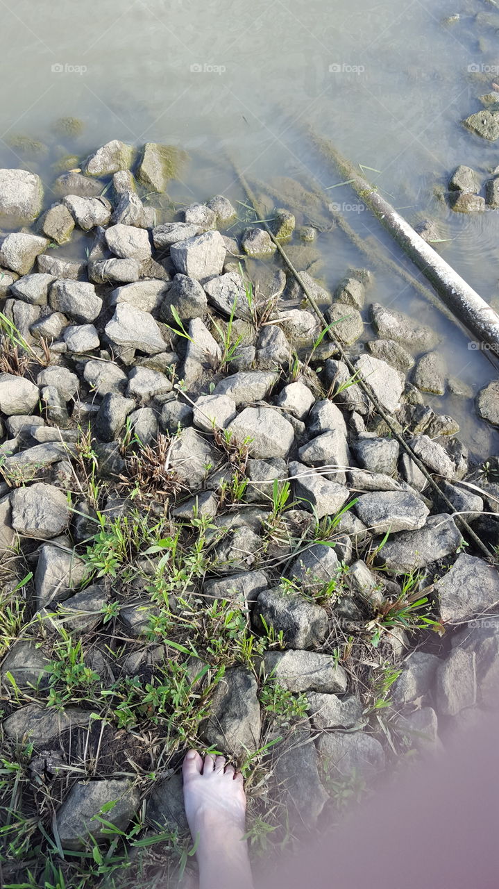 Standing on a rivers edge