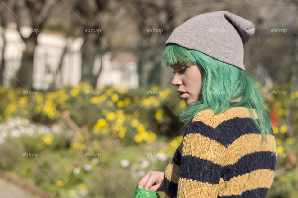 Alternative girl in the park with green hair