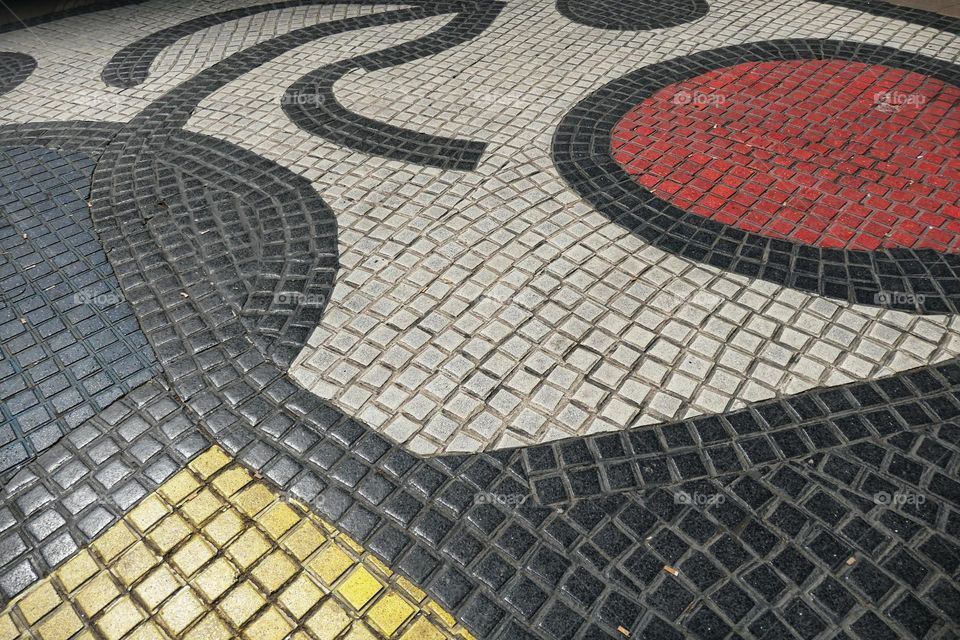 Painted paving stones in a street of Barcelona