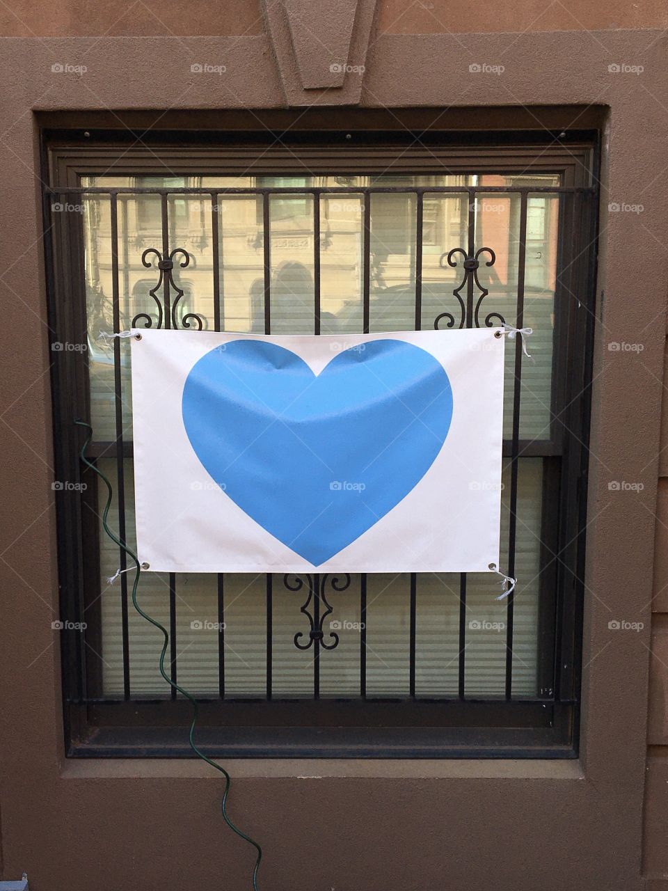 Blue heart in window to recognize frontline workers