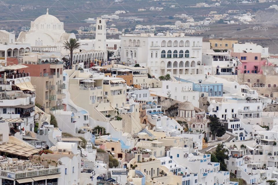 White cliffside buildings in Fira, Santorini, Greece 