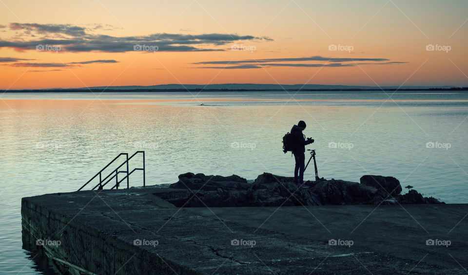 Photographer at sunset