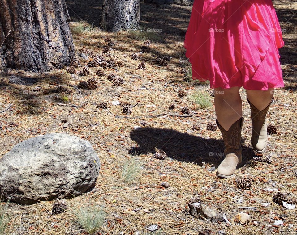 A cowgirl bridesmaid takes her walk down the forest aisle for a country wedding in outdoor Oregon. 