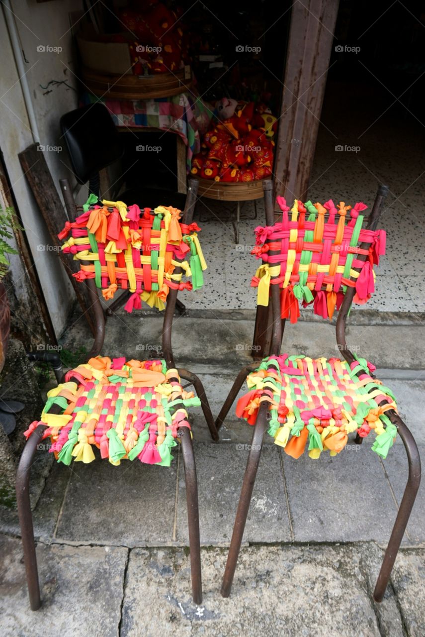 Two colorful chair shall brighten up your day.