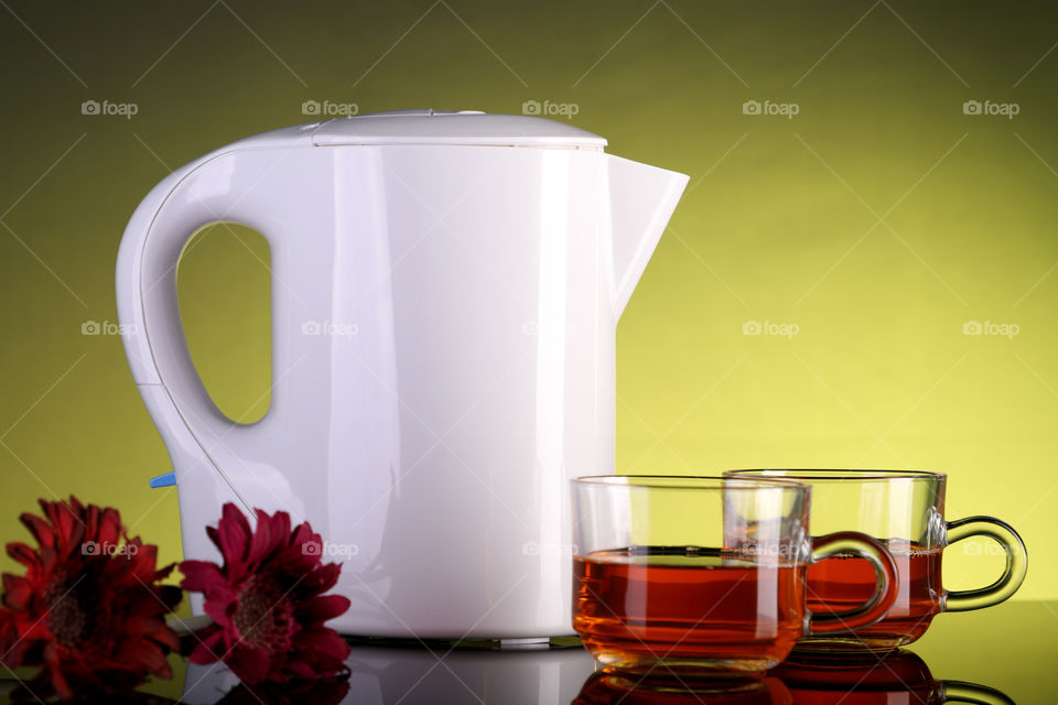 White kettle and tea coffee cups