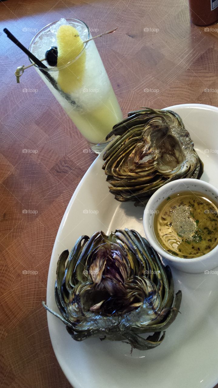lunch. cocktail and artichoke