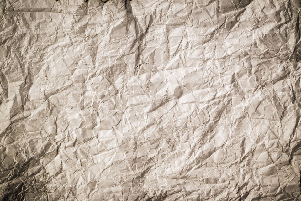 Crumpled paper background. Crumpled texture of brown paper background