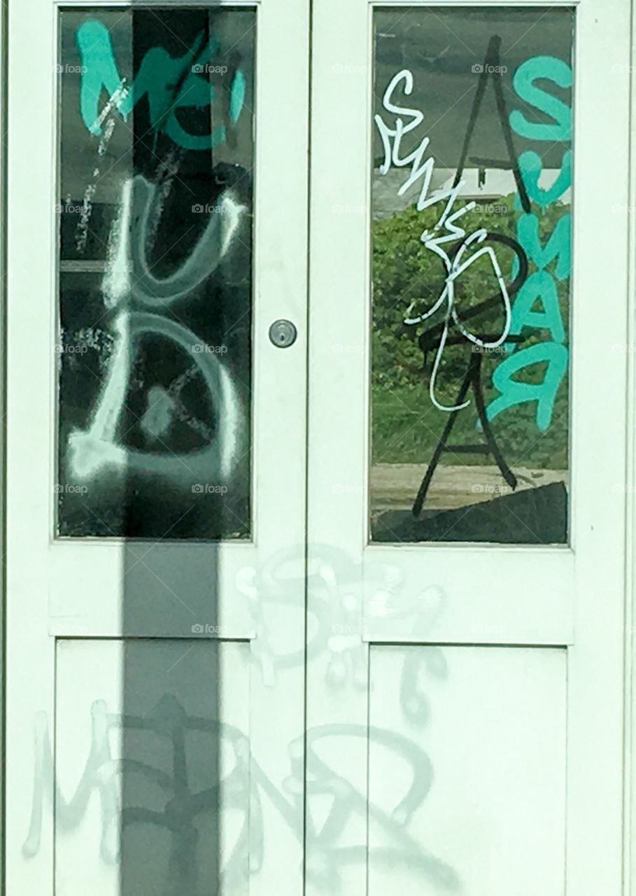 White door with graffiti